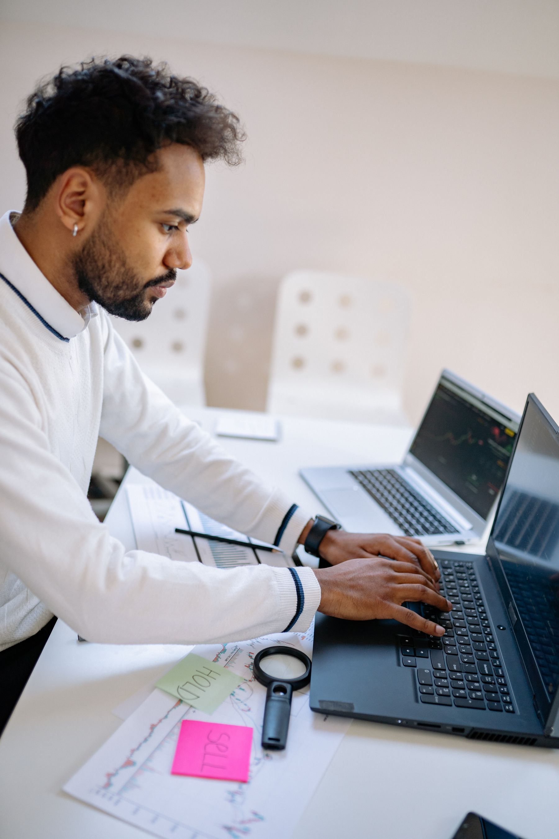 Founder working through a review on a laptop in a bright office